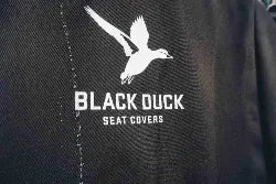 Black duck logo on a seat cover with 'Black Duck Seat Covers' text.